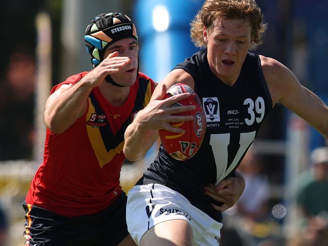 ADELAIDE, AUSTRALIA - APRIL 06: Josh Ryan of South Australia tackles Hugh Dixon of Victoria during the 2024 AAMI State Game between SANFL West End State Team and Smithy's VFL State Team at Glenelg Oval, on April 06, 2024, in Adelaide, Australia. (Photo by Maya Thompson/AFL Photos/via Getty Images)