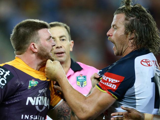 Josh McGuire of Brisbane takes on Ashton Sims of the Cowboys during the NRL match between the Brisbane Broncos and the North Queensland Cowboys. Pic Darren England.