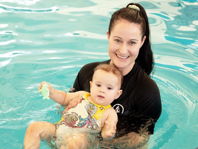 Toddlers receiving free swimming lessons from Bluefit Swimming at the Cotton Tree pool. Pictured, Hannah Searle with 11 month old Melia Head. Photo: Patrick Woods.