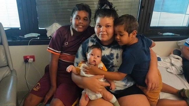 Darius with his mum Sarah and brothers Jamahl and Javan.