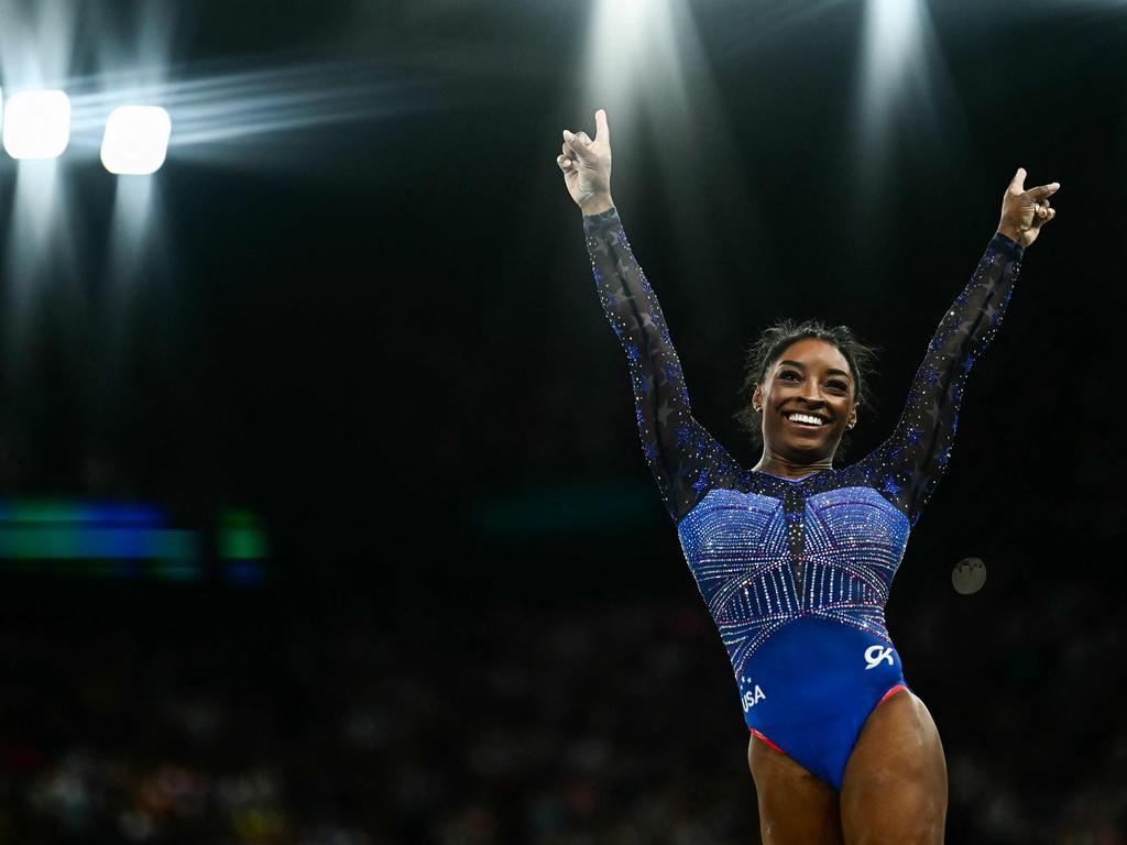 TOPSHOT – US' Simone Biles competes in the floor exercise event of the artistic gymnastics women's all around final during the Paris 2024 Olympic Games at the Bercy Arena in Paris, on August 1, 2024. (Photo by Loic VENANCE / AFP)