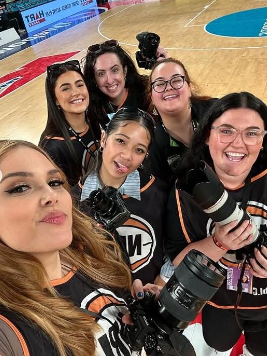 Athena with the NBL’s girl group of photographers in Melbourne. Picture: IG/CassyAthena