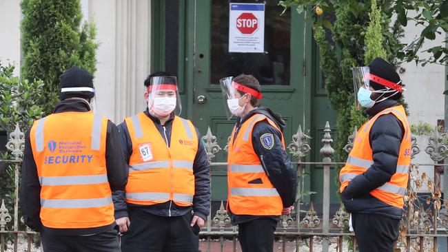 Guards at the building on Monday. Picture: David Crosling