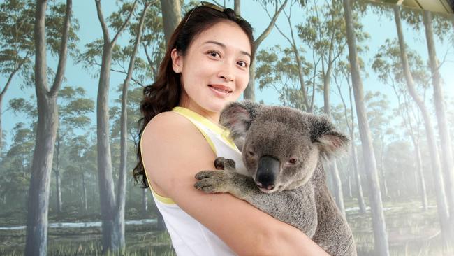 Huang Ge Ping meets a koala at Paradise Country. Pic: AdamHead