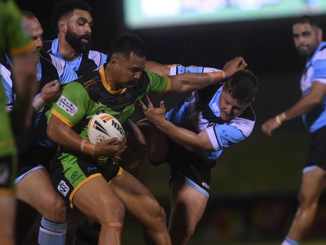 Palmerston Raiders fend off Northern Sharks captain Jacob Collie in the NRLNT Grand Final 2022. Picture: (A)manda Parkinson