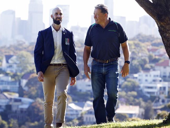 Civilian struggles: Ex Wallaby player Phil Kearns (right) and former army sergeant Justin Donnelly (left) share stories in Mosman on Thursday. Picture: Sam Ruttyn