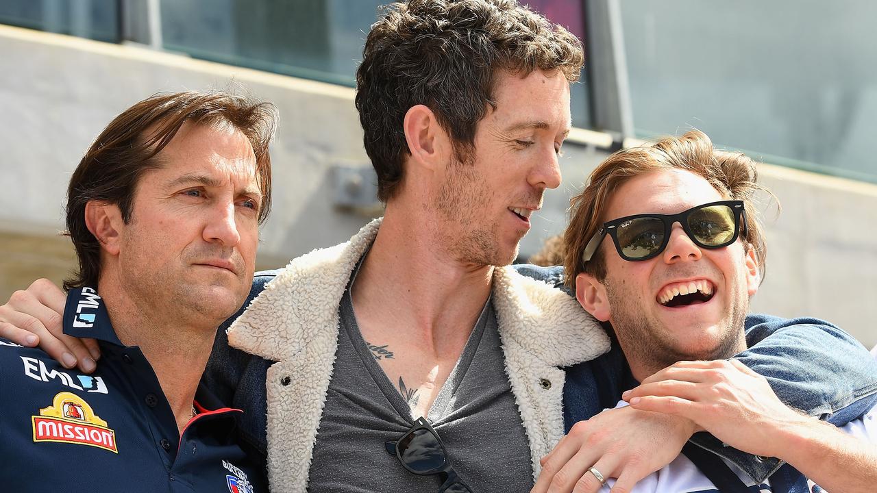 Luke Beveridge, Robert Murphy and Caleb Daniel after the 2016 grand final. Picture: Quinn Rooney (Getty).