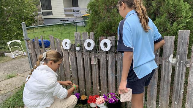 David Vale’s children at a memorial set up outside the Kempsey home he drive to after allegedly being stabbed. Picture: Janine Watson