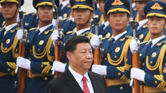 Chinese President Xi Jinping walks past a military honour guard in Beijing. Picture: AFP