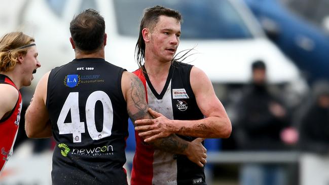 Dane-Francis Whitfield of Creswick is congratulated by teammates after kicking a goal during the Creswick match against Ballan. Photo by Josh Chadwick