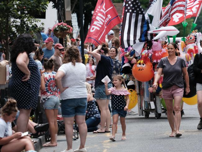 SAUGERTIES, NY - JULY 04: People watch the annual Fourth of July parade on July 04, 2021 in Saugerties, New York. Across the nation, Americans are celebrating this weekend to mark Independence Day with parades, fireworks, barbecues and other celebrations. While pandemic restrictions have been lifted for many of this yearâs activities, the new Delta variant of Covid-19 is hospitalizing thousands of Americans who have so far not gotten a vaccine.   Spencer Platt/Getty Images/AFP == FOR NEWSPAPERS, INTERNET, TELCOS & TELEVISION USE ONLY ==