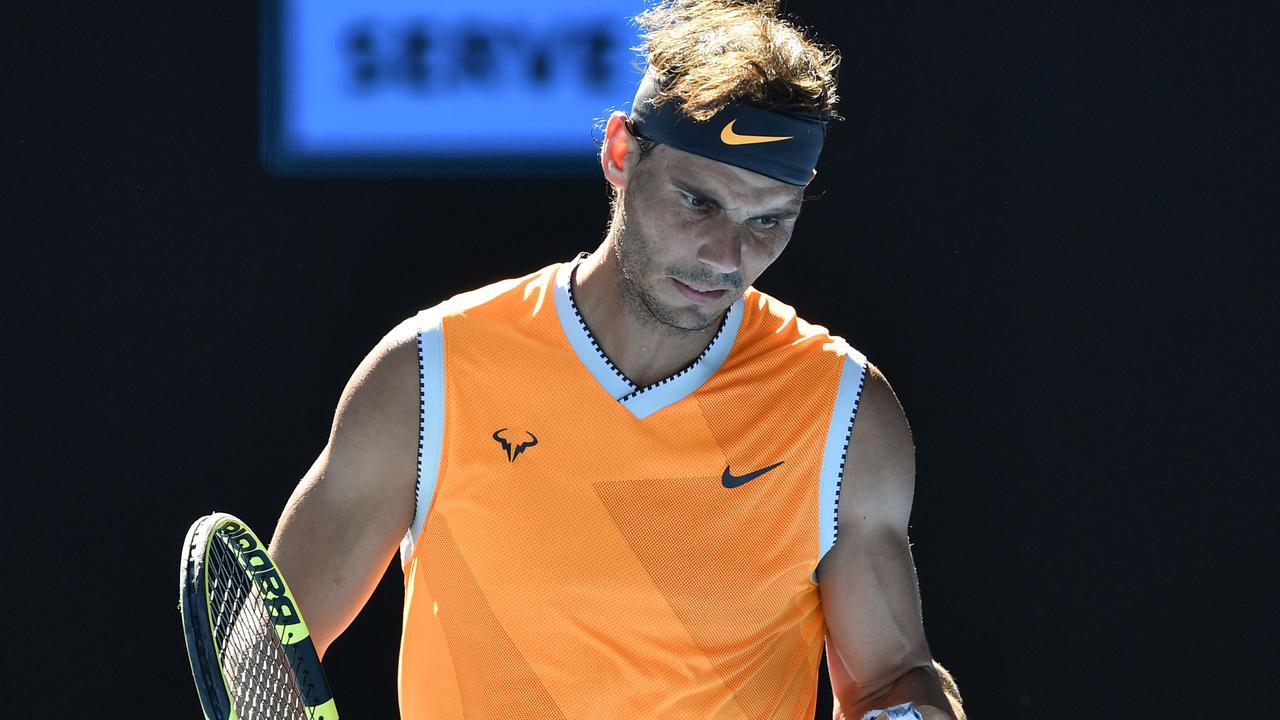 Spain's Rafael Nadal reacts after a point against Czech Republic's Tomas Berdych during their men's singles match on day seven of the Australian Open tennis tournament in Melbourne on January 20, 2019. (Photo by SAEED KHAN / AFP) / -- IMAGE RESTRICTED TO EDITORIAL USE - STRICTLY NO COMMERCIAL USE --