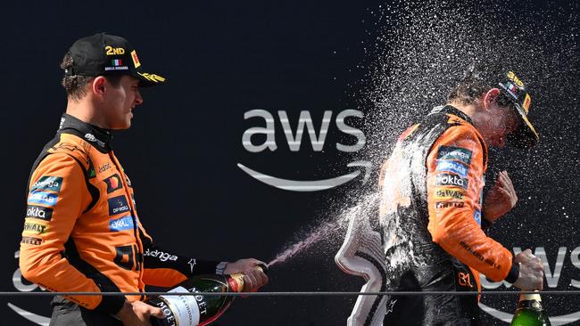 Lando Norris and his McLaren teammate Oscar Piastri on the podium.
