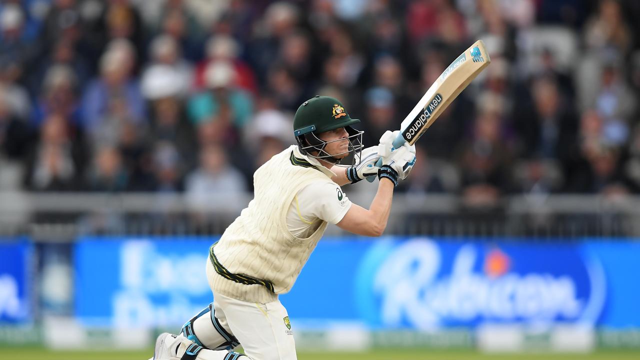 Down on both knees, Smith still manages to find a way to thread the off side field. Picture: Alex Davidson/Getty Images.