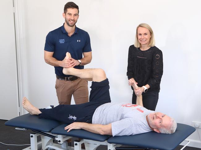 Lachlan Whiting and Sara Coulter from Geelong and Surrounds Occupational Therapy. Pictured with stroke victim and client Tony Harris. picture: Glenn Ferguson