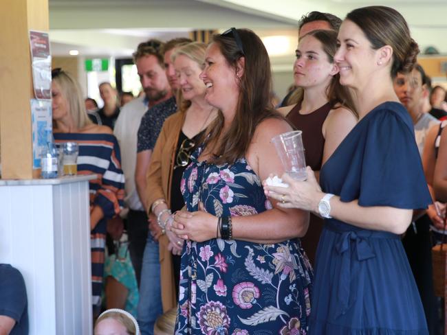 Kelly Hardy (centre) watches her “living funeral” with sister Jamienne Thomspon (right).