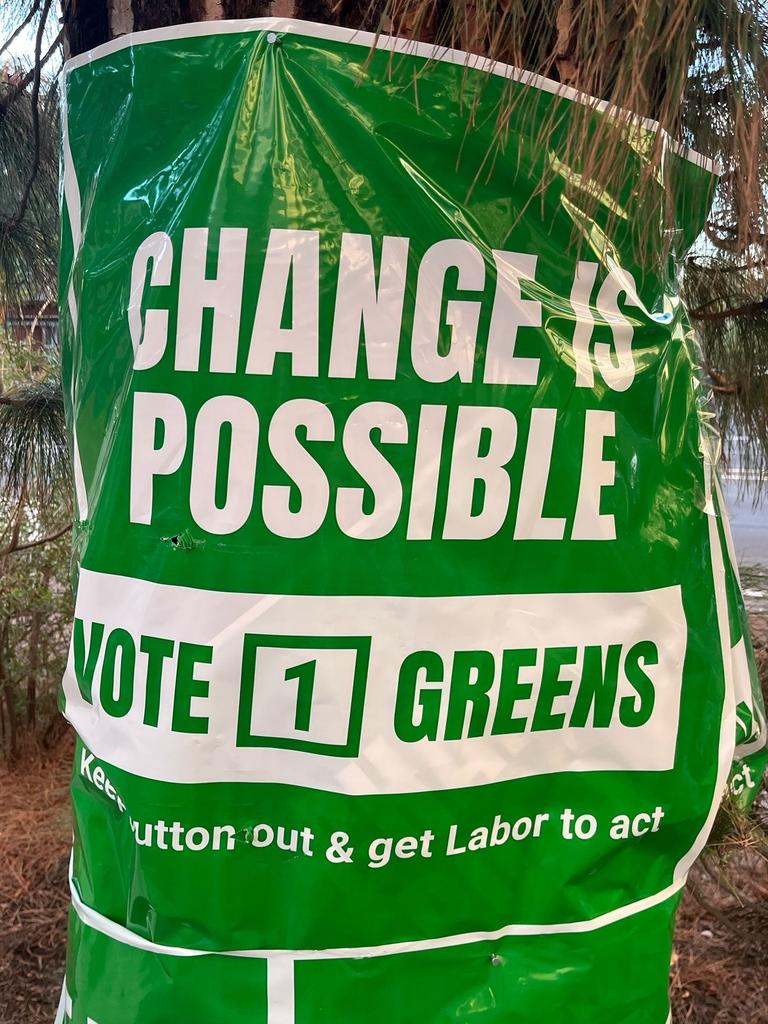 Greens posters nailed into trees at a polling booth in the Sturt electorate. Picture: Supplied