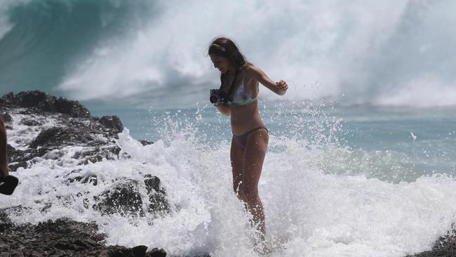 Beach-goers also took the opportunity to play in the waves. Picture Mike Batterham