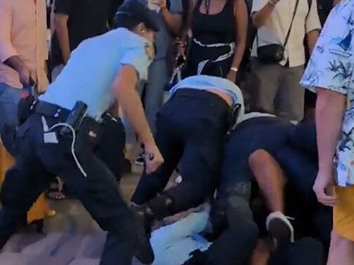 Drunk Aussie wrestled to the ground by armed airport police after being told 'no more beer. Picture: Viral Press