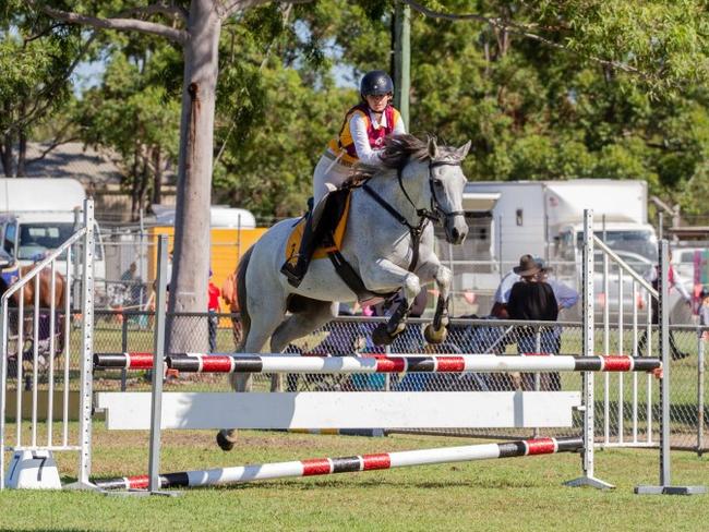 A Zone 7 rider clears the oxer at the 2023 PQC State Showjumping Championships.