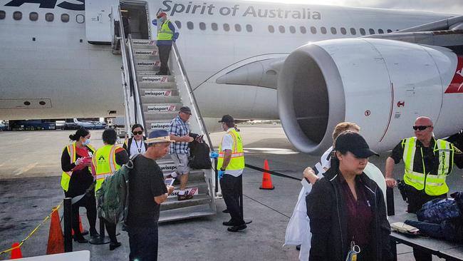 Norwegian Jewel passengers undertaking security checks before boarding a Qantas rescue plane to fly home to Sydney from Hawaii. Picture: Tom Huntley