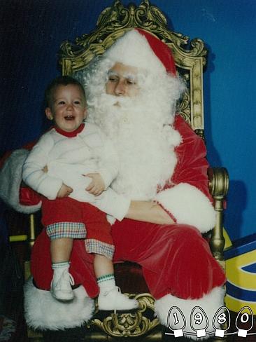 1980 ... Mike sits with Santa around the age of one. Picture: Martin Gray