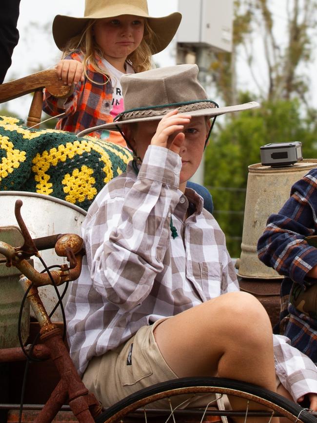 A float rider tips his hat to the crowd at the 2023 Gayndah Orange Festival.