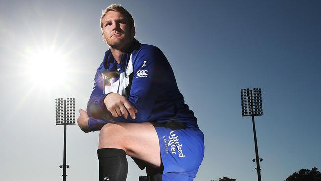 Canterbury Bulldogs player Aiden Tolman, a White Ribbon Ambassador with the socks they will wear in Friday nights game against the Tigers. Picture. Phil Hillyard