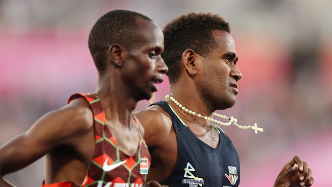 Rosefelo Siosi of the Solomon Islands gets lapped in the final. Picture: Michael Klein