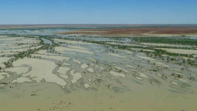 Water spills from the Warburton River to flood Goyder Lagoon, South Australia. Picture: Mark Day