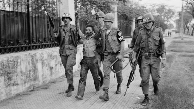 US military police with a captured Vietcong guerilla outside the US embassy.