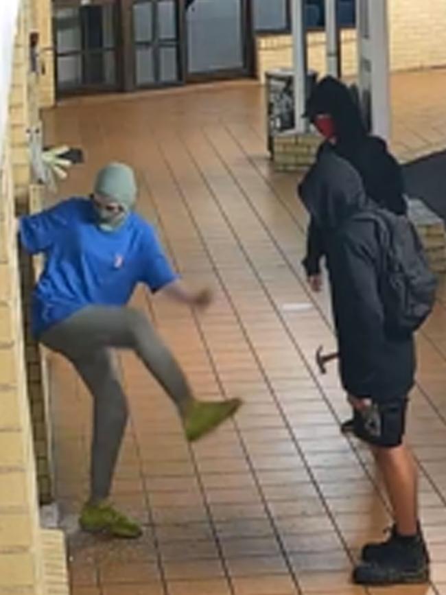 Youths pictured breaking into the Black Lime Cafe in Carrara.