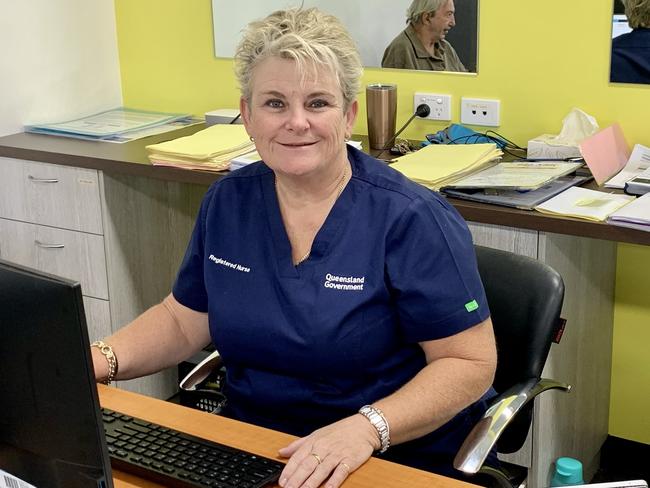 Mackay registered nurse Alison Cooper checking in patients at the new vaccination hub at CQUniversity's Mackay city campus. Picture: Rae Wilson