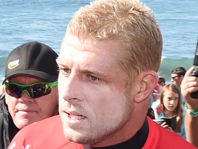 Bells Rip Curl Pro Day 2 Men's Round 1. Mick Fanning high fives a fan after his first round win. Picture: Jason Sammon Friday 25 March 2016