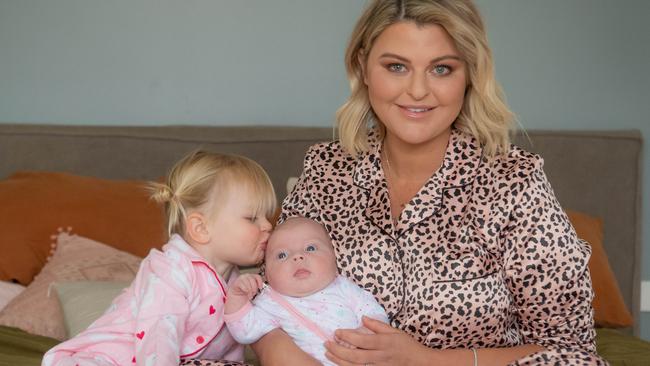 Emma Hawkins at home with her two daughters. Picture: Jason Edwards 