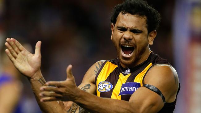 Cyril Rioli celebrates a goal while playing for the Hawks. Picture: Getty Images