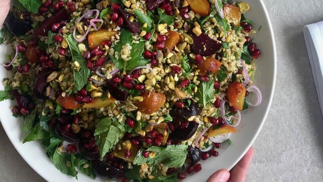 Eleven and Lou’s Place co-founder Themis Chryssidis’s Sumac baked salmon with pomegranate tabouli dish.