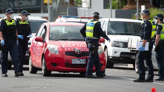 Police stopped about 30 protesters who drove in a convoy around a Preston hotel where refugees are being detained on Good Friday. Picture: Tony Gough