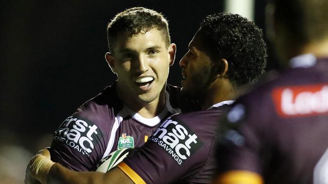 Corey Oates celebrates a try for the Broncos.
