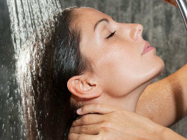 Natural Beauty relaxing under a steamy hot shower. Natural nails, hair and no make-up. Nikon D3X. Converted from RAW.