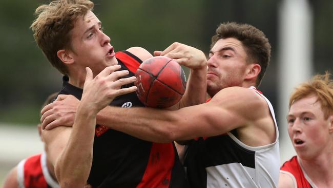 NFL: Eltham’s Daniel Evans tries to control the ball. Picture: Stuart Milligan