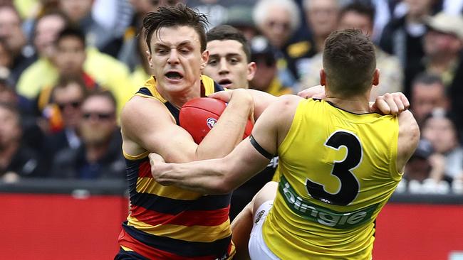 Jake Lever and Dion Prestia collide. Picture: Sarah Reed