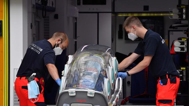 German army emergency personnel load into their ambulance the stretcher that was used to transport Russian opposition figure Alexei Navalny on August 22, 2020 at Berlin's Charite hospital, where Navalny will be treated.