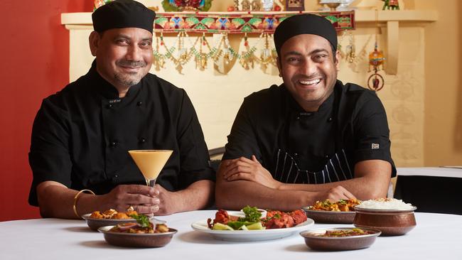 Chefs Gurjeet Singh and Sukhdeep Singh with their curries at Harvest of India. Photo: AAP Image/Matt Loxton