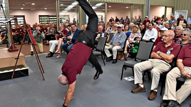 Buderim Men's Shed president Barry Cheales does a cartwheel for the opening. Picture: Warren Lynam