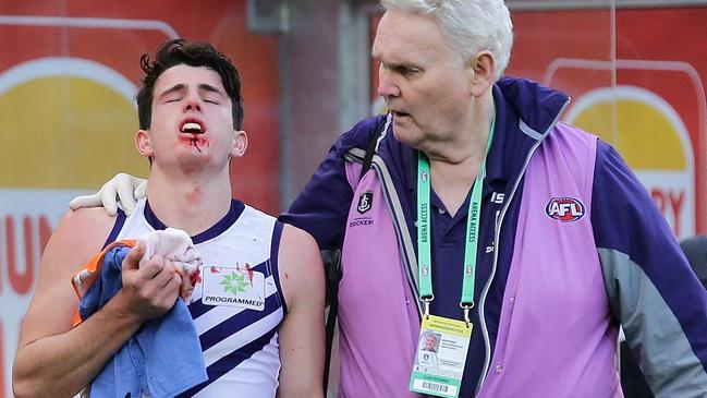 A Fremantle doctor helps Andrew Brayshaw after he was struck by Andrew Gaff. Picture: Will Russell/AFL Media