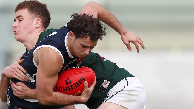 Hamilton player Hamish Cook tackles Mitch Fino in the interleague match. Picture: Yuri Kouzmin