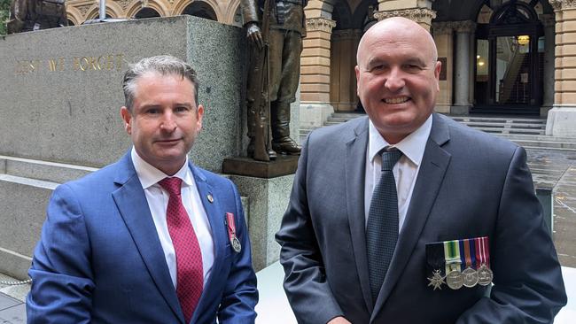 Shadow veterans Minister Greg Warren and Veterans Minister David Elliott, both former servicemen, will lead the march side-by-side for the first time. Picture: Supplied