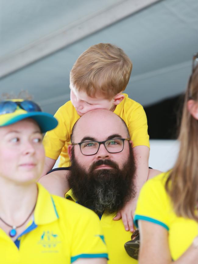 Damon Kelly and his son at the Commonwealth Games Athletes Parade through Queen Street, Brisbane on Friday, April 27, 2018. (AAP Image/Claudia Baxter)