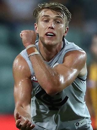 Patrick Cripps fires off one of his 21 handballs.